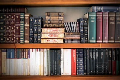 hardcover books sitting on bookshelf