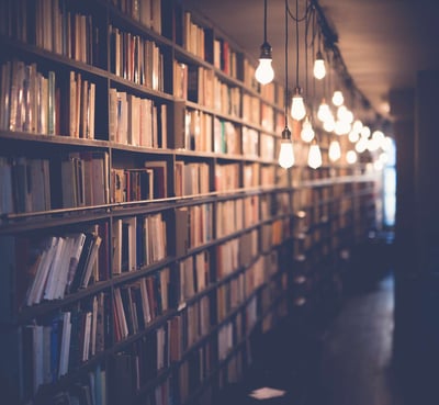 dim library lit by dangling lights